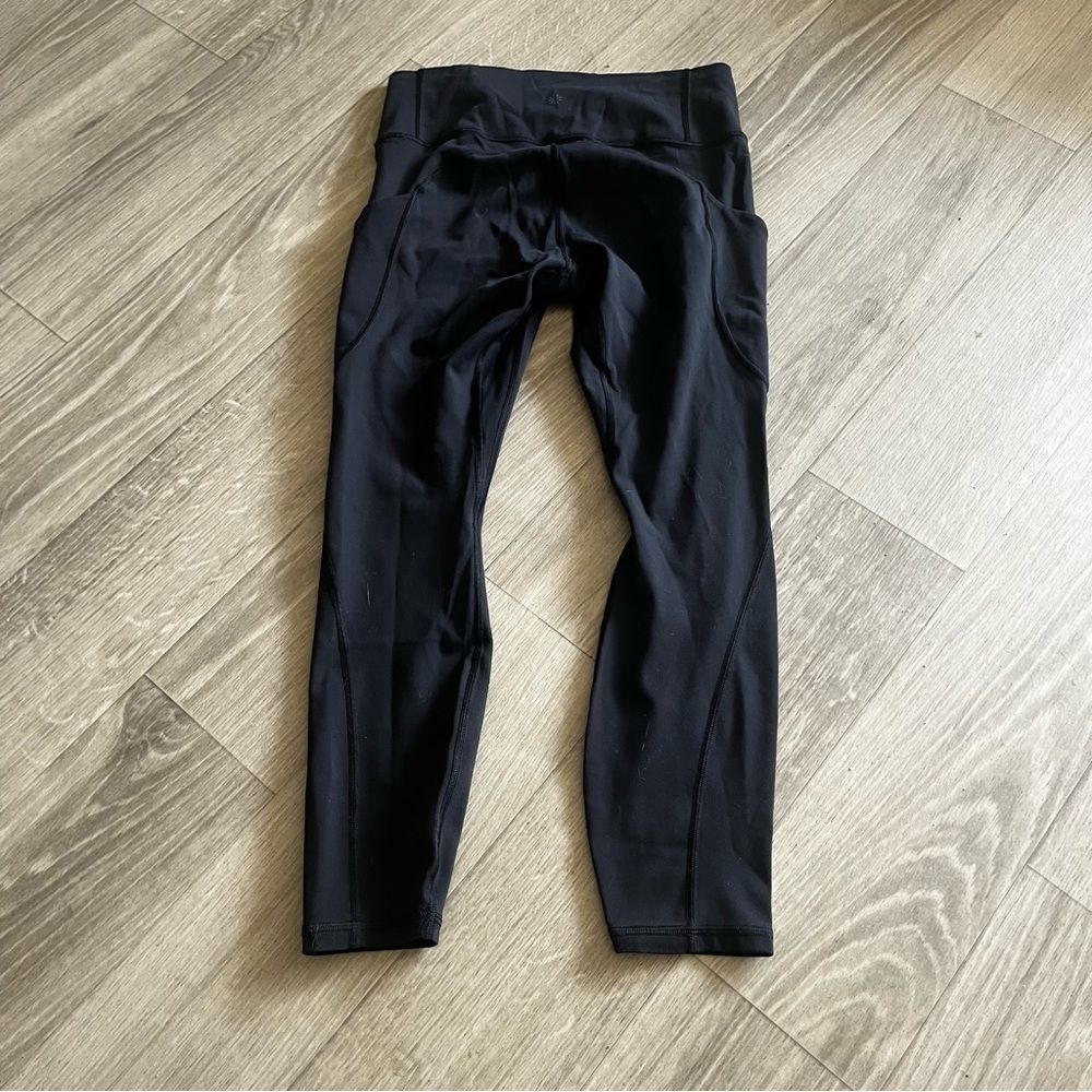 athleta black compressive high rise leggings with side pockets medium